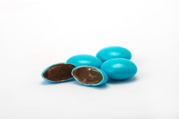 dragees with chocolate filing on white background