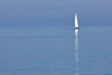 White sailing yacht in the blue sea on the horizon. Seascape. Minimalism. - 262095678