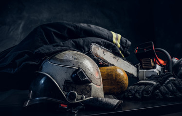 Safety gear, helmet, oxygen balon and chainsaw © Fxquadro