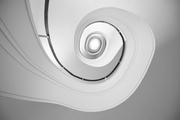 Spiral stairway. Bottom view. Geometry in architecture.