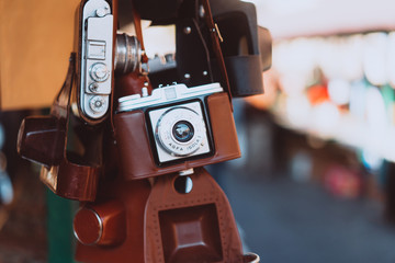 Old camera hanging on a city street