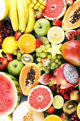 Tropical fruits background, many colorful ripe fresh tropical fruits