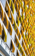 High-rise modern building with curved and painted decorative elements