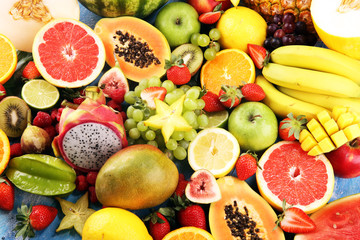 Tropical fruits background, many colorful ripe fresh tropical fruits