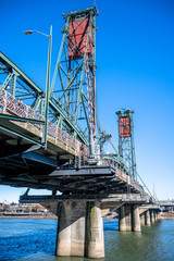 Lifting truss Hawthorne bridge with two towers across the Willamette River in the center of Portland Oregon
