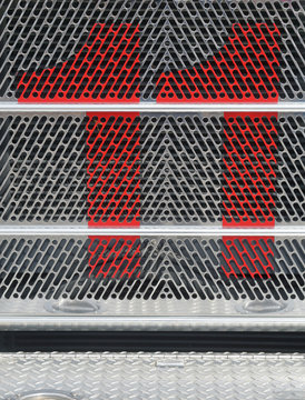 Number Eleven Painted Red On Steel Grille