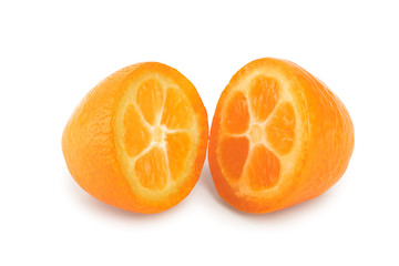 Cumquat or kumquat half isolated on white background
