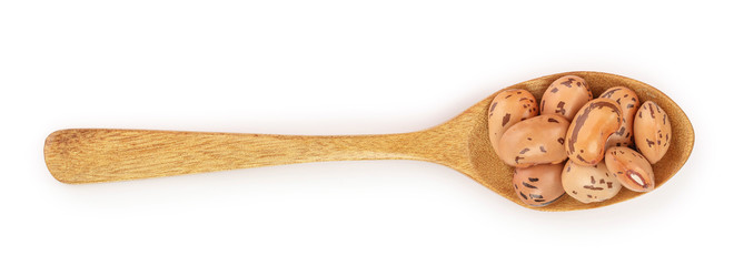 brown kidney bean in wooden spoon isolated on white background. Top view. Flat lay