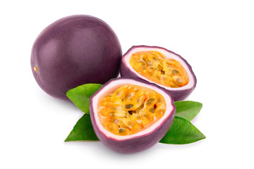 whole passion fruits and a half with leaves isolated on white background. Isolated maracuya