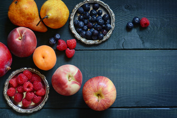 Variety of fresh fruit arranged on a wooden table