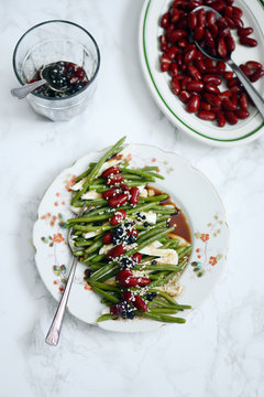 Green beans topped with kidney beans and tofu