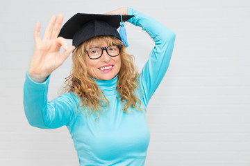 adult student with isolated graduation cap