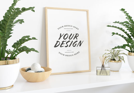
Vertical Frame Leaning on Shelf with Plants Mockup