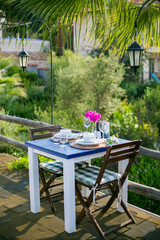 arranged for a holiday, open-air dining table