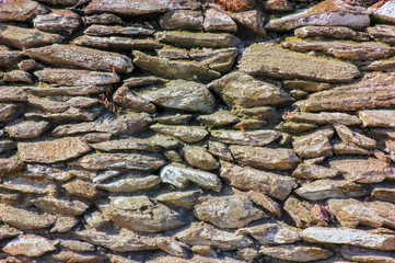 Texture of a stone wall. The texture of the wall of natural stone.
