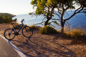 Fototapeta na wymiar Wonderful greek island Spetses and ecological bicycle in rent and fresh air and transparent water
