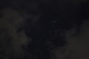 Obraz na płótnie Canvas Andromeda Galaxy on a Cloudy Sky