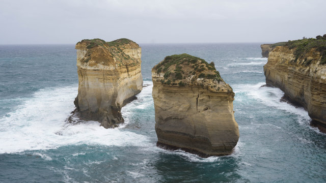 Two isolated cliffs and rock formations along The Great Ocean Road, caused by water erosion, Australia
