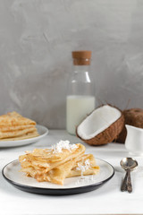 Morning, breakfast - traditional russian blini pancakes, french crepes, fresh coconut, milk bottle,...