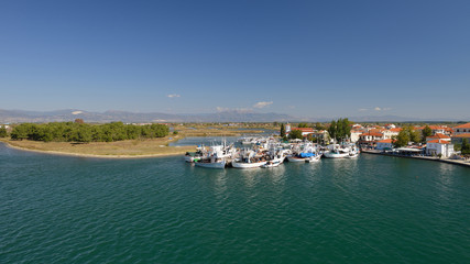 Fototapeta premium Keramoti, Greece port with boats, promenade view, tavernas, cafe and restaurants