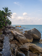 Fototapeta na wymiar Wooden paths along the sea. Koh Phangan. Thailand.