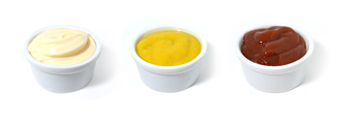Sauces. Mayonnaise, Catchup and mustard in small porcelain containers.