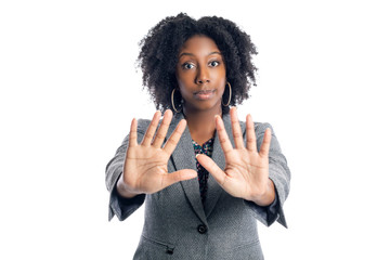 Black African American female businesswoman isolated on a white background doing a stop gesture
