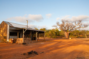 Fototapeta na wymiar Old fisherman's hut and remains of a camp fire at a squatters camp near Honeymoon Bay, Kalumburu, Western Australia.