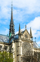 Fototapeta na wymiar Spire and Southern rose window of Cathedral Notre Dame de Paris