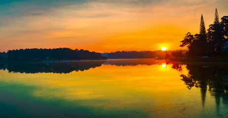 Fototapeta premium Sunrise over Xuan Huong Lake, Dalat, Vietnam. Panorama