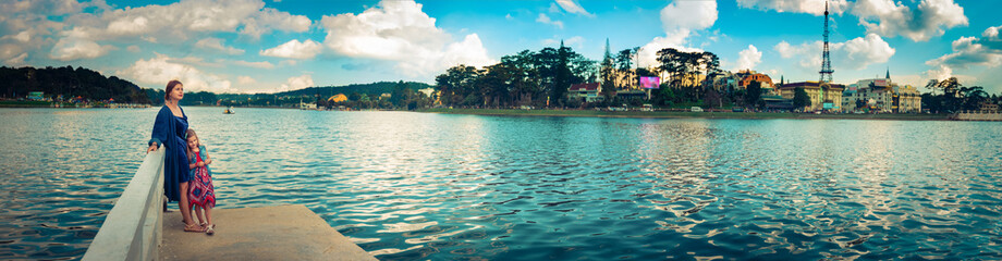 Mother and daughter at Xuan Huong Lake, Dalat, Vietnam. Panorama