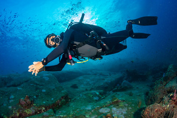 SCUBA diver on a colorful, healthy tropical coral reef