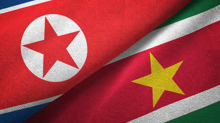 North Korea and Suriname two flags textile cloth, fabric texture