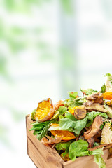 Vegetable kitchen food waste in a re used wooden container for home composting kitchen bacground