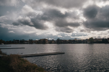 Wharf on little lake at classic european town