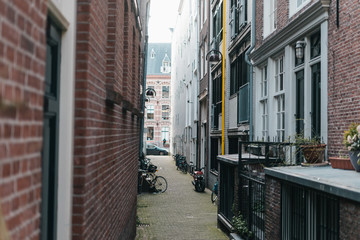 Cozy narrow european street with old red brick houses