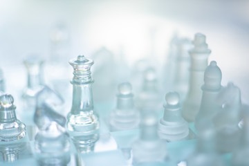 Chess board game made of glass, business competitive concept