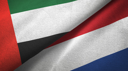 United Arab Emirates and Netherlands two flags textile cloth, fabric texture