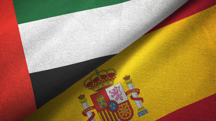 United Arab Emirates and Spain two flags textile cloth, fabric texture