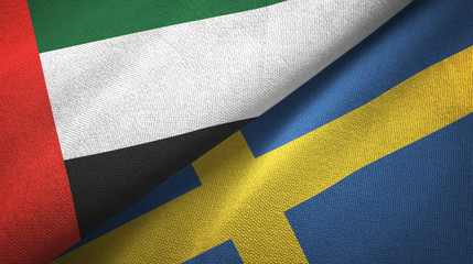 United Arab Emirates and Sweden two flags textile cloth, fabric texture