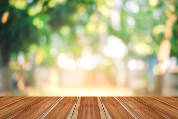 Wood floor with leaf bokeh nature background 