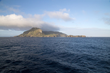 The stunning Nightingale Island with an amazing cloud formation of a blue sea. 