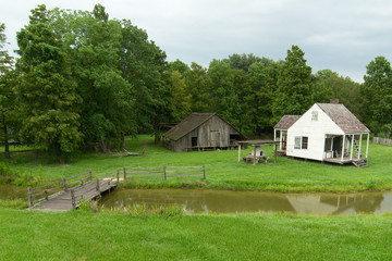 Cabin and barn at LSU Rural Life Museum, an outdoor museum of Louisiana history, Baton Rouge, Louisiana.
