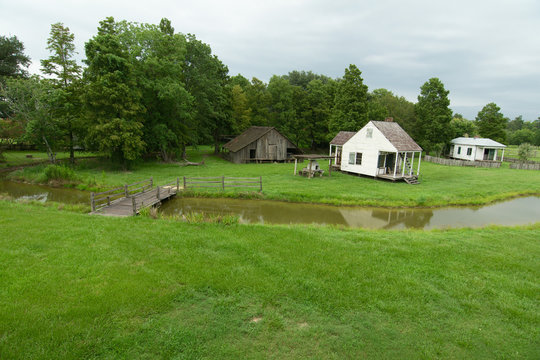 Cabin and barn at LSU Rural Life Museum, an outdoor museum of Louisiana history, Baton Rouge, Louisiana.