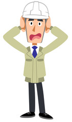 ヘルメットを装着して頭を抱える工務店の男性