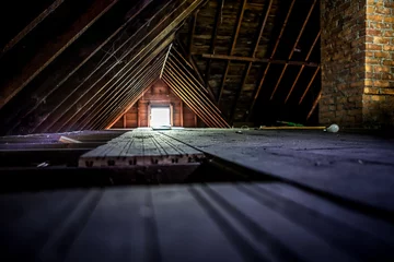 Foto auf Leinwand Old attic space with roof rafters and a window © soupstock