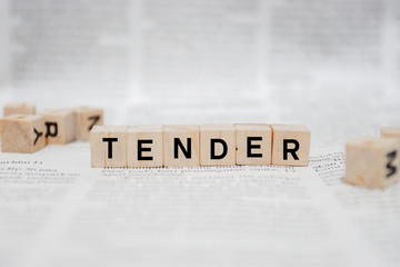 Tender Word Written In Wooden Cube - Newspaper