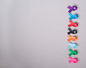 Different ribbons, symbols of cancer, cancer awareness month.  Copy space for your text.