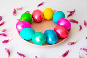 Easter eggs multicolored isolated on white background. Minimal easter concept. Happy easter card with copy space for text. Top view, flat.