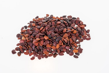 Dalbergia cochinchinensisseeds on white background.
